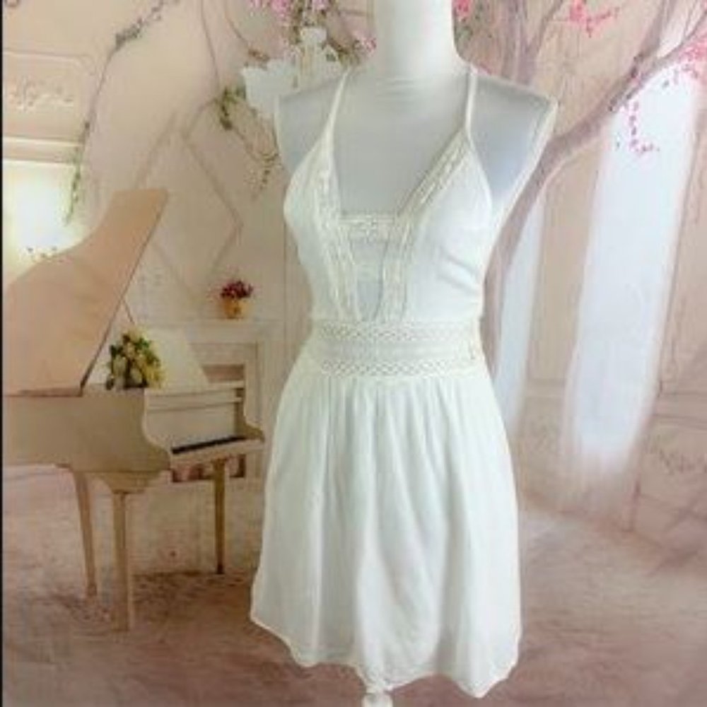 White mini dress with lace and cut outs